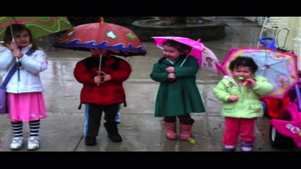 Ed O'keefe's children holding umbrellas